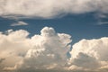 Large cumulous clouds fill the blue sky in Colorado