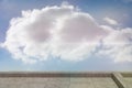 Large cumulus cloud floating above stone-tiled terrace under clear blue sky in flat vector design Royalty Free Stock Photo