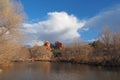 Large cumulus cloud over Cathedral Rock in Red Rock State Park outside of Sedona, Arizona in winter. Royalty Free Stock Photo
