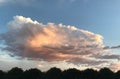 Large cumulus clouds hover over the southwest skies