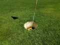 Large cup or hole with flag stick for foot golf