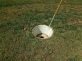 Large cup or hole with flag stick for foot golf