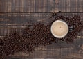 Large cup with hot cappuchino with coffee beans