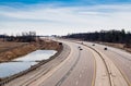 Large curving highway in rural area.