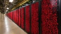 large data center corridor with rows of black server racks with red binary code displayed. Royalty Free Stock Photo