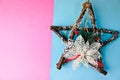 Large decorative beautiful wooden Christmas star, a self-made advent wreath of fir branches and sticks on the festive New Year Royalty Free Stock Photo