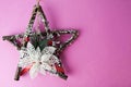 Large decorative beautiful wooden Christmas star, a self-made advent wreath of fir branches and sticks on the festive New Year Royalty Free Stock Photo