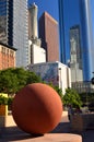 A large decorative cement ball stands still