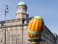 A large decorative Easter egg against a building in the city of Copenhagen Royalty Free Stock Photo