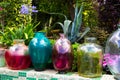Colorfull, decorative glass jars in the garden