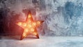 Large decorative retro star with lots of burning lights on grunge concrete background. Beautiful decor, modern design Royalty Free Stock Photo