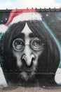 A very cool Christmas graffiti of John Lennon from the Beatles, Shoreditch, uk