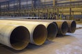 Large diameter pipes are in an industrial workshop