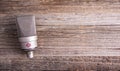 Large diaphragm condenser studio microphone Neumann tlm 103 on a wooden background.