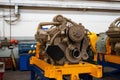 Large diesel engine with a huge turbine in the warehouse of finished products factory for the production of large mining trucks