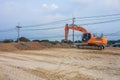 Large diesel mechanical excavator digging earth machine at excavation working in construction site