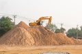 Large diesel mechanical excavator digging earth machine at excavation working in road construction