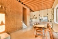 a large dining room with a wooden table and chairs