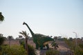 A large dinosaur sculpture stands in a park in egypt Royalty Free Stock Photo