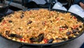 Large dish of paella on the market Royalty Free Stock Photo