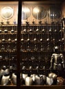 Large display case with a large quantity of swords and ancient armor, in the historic Stibbert villa in Florence.