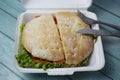 Large disposable styrofoam meal box, with a beirut sandwich (Beirut is a Brazilian sandwich).