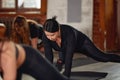 Large diverse group of people doing aerobics exercises in a class in a gym in a health and fitness concept Royalty Free Stock Photo