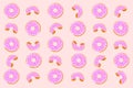 Large donut with pink filling and multi-colored sprinkles texture pattern Royalty Free Stock Photo