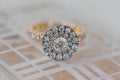 Round halo diamond wedding engagement ring on white background