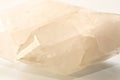 Large double pointed clear quartz crystal over white