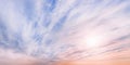 Large dramatic pastel colored cloudscape at sunset