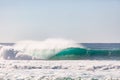 Large dramatic wave breaking hard over volcanic reef in hawaii Royalty Free Stock Photo