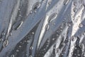 Large drops of water on a background of black polyethylene. Background image.