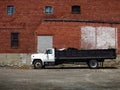 Large Dumptruck and Brick Building