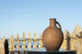 Large earthenware jug stands on a table on the shore near the sea water in Batumi, Georgia Royalty Free Stock Photo