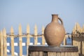 Large earthenware jug stands on a table on the shore near the sea water in Batumi, Georgia Royalty Free Stock Photo