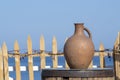 Large earthenware jug stands on a table on the shore near the sea water in Batumi, Georgia Royalty Free Stock Photo