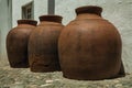 Large earthenware vessels over floor