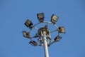 A large electric pole filled with spotlights in the blue sky Royalty Free Stock Photo