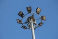 A large electric pole filled with spotlights in the blue sky Royalty Free Stock Photo
