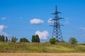 A large electric pole on a hill. Electric pylons. Electricity business. Thick wires. High voltage. Networks for powering Royalty Free Stock Photo