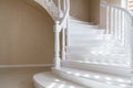 Large, elegant, new, clean, white natural wood stairs in the house