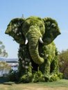 A large elephant made out of plants and grass, AI