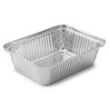 A large, empty aluminum roasting pan with a perforated lid sitting on a white background isolated on white background Royalty Free Stock Photo