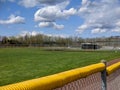 A large, empty baseball field on a bright, sunny day Royalty Free Stock Photo