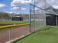 A large, empty baseball field on a bright, sunny day Royalty Free Stock Photo