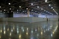 Large empty exhibition hall interior in an industrial building with fencing and high vertical columns with and high ceiling and ar Royalty Free Stock Photo