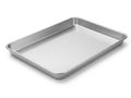 A large, empty, rectangular, stainless steel baking tray on a white background Royalty Free Stock Photo