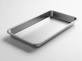 A large, empty, rectangular stainless steel baking tray on a white surface Royalty Free Stock Photo