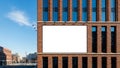 Blank Billboard Mockup on Modern Brick Building in Urban Setting Royalty Free Stock Photo